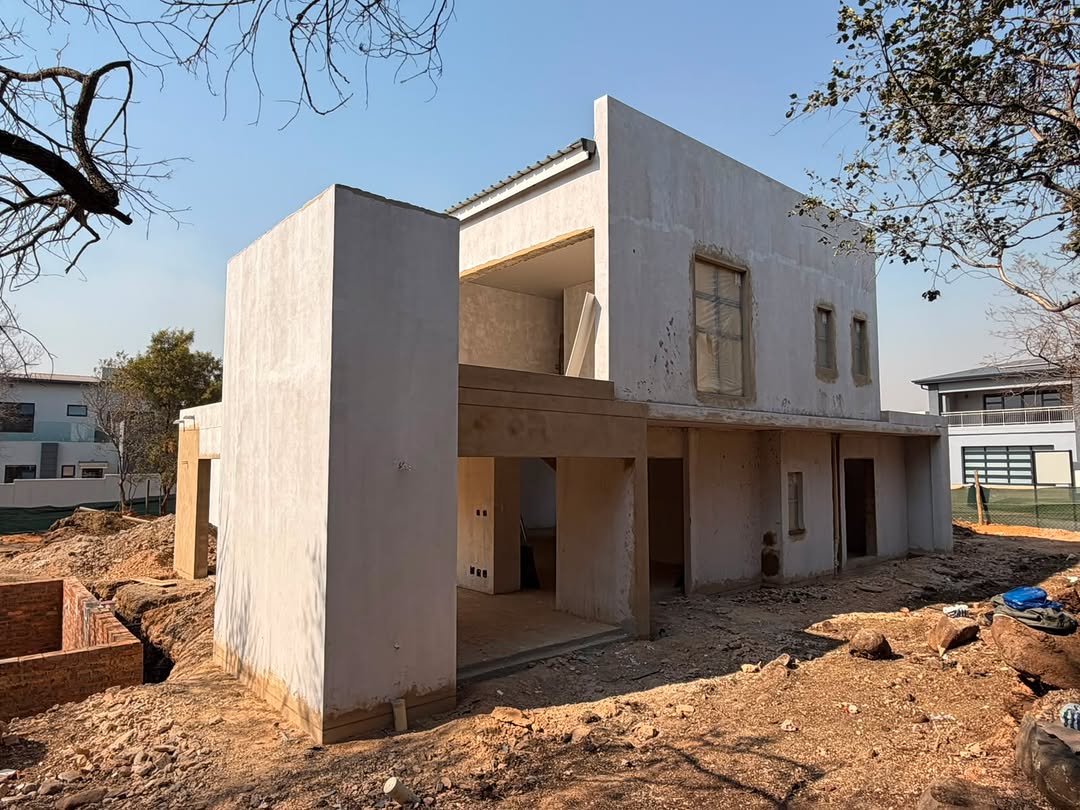 Two storey residential shell with cantilever balcony
