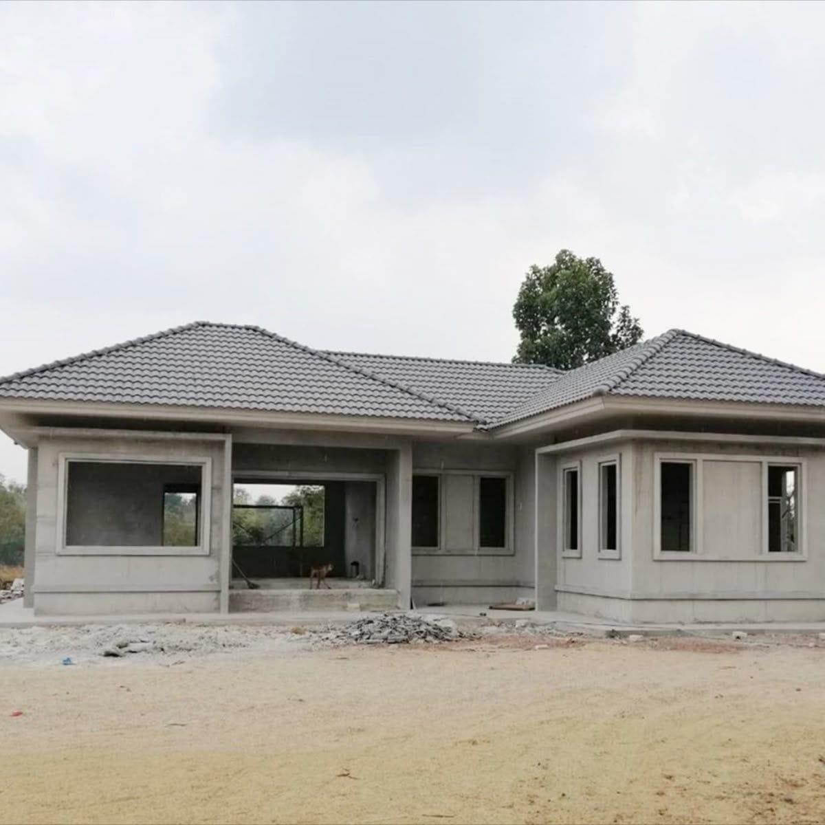 Completed roof and plastered facade of a family home